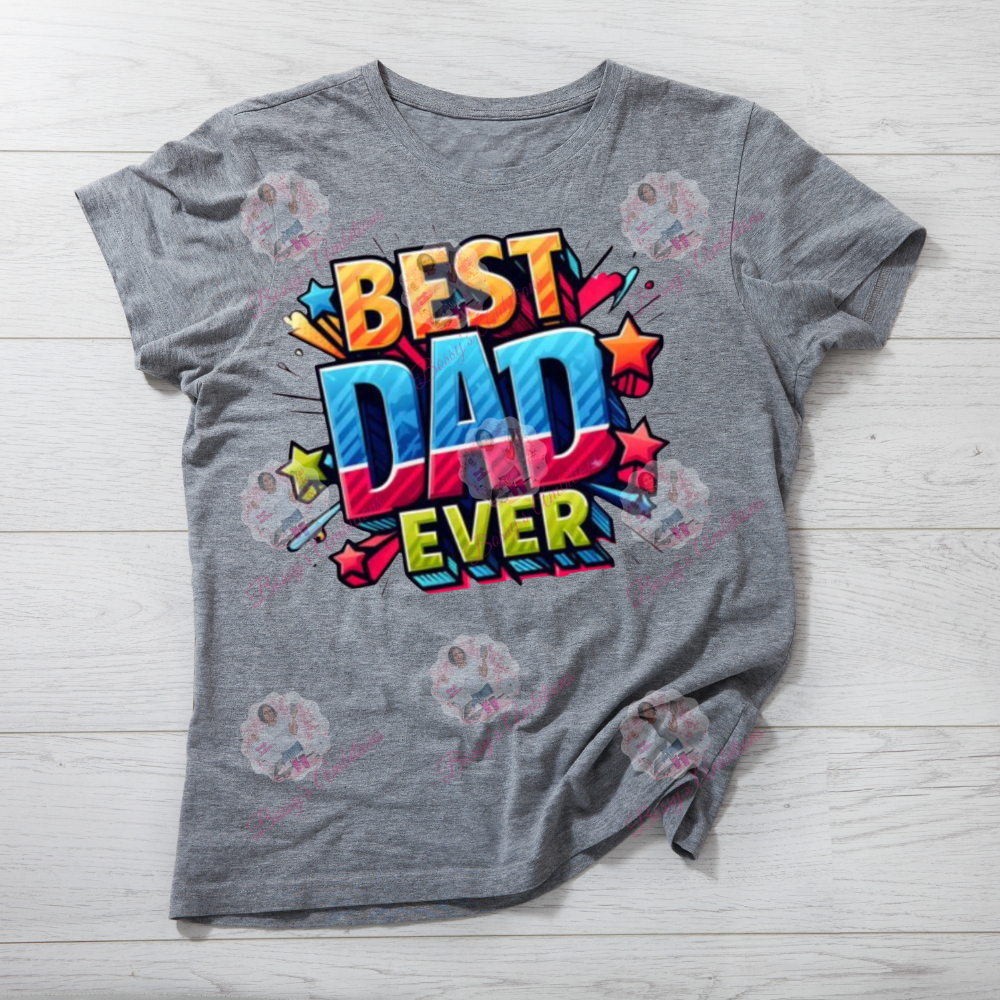 Gray t-shirt with 'Best Dad Ever' colorful text design on a light wooden surface