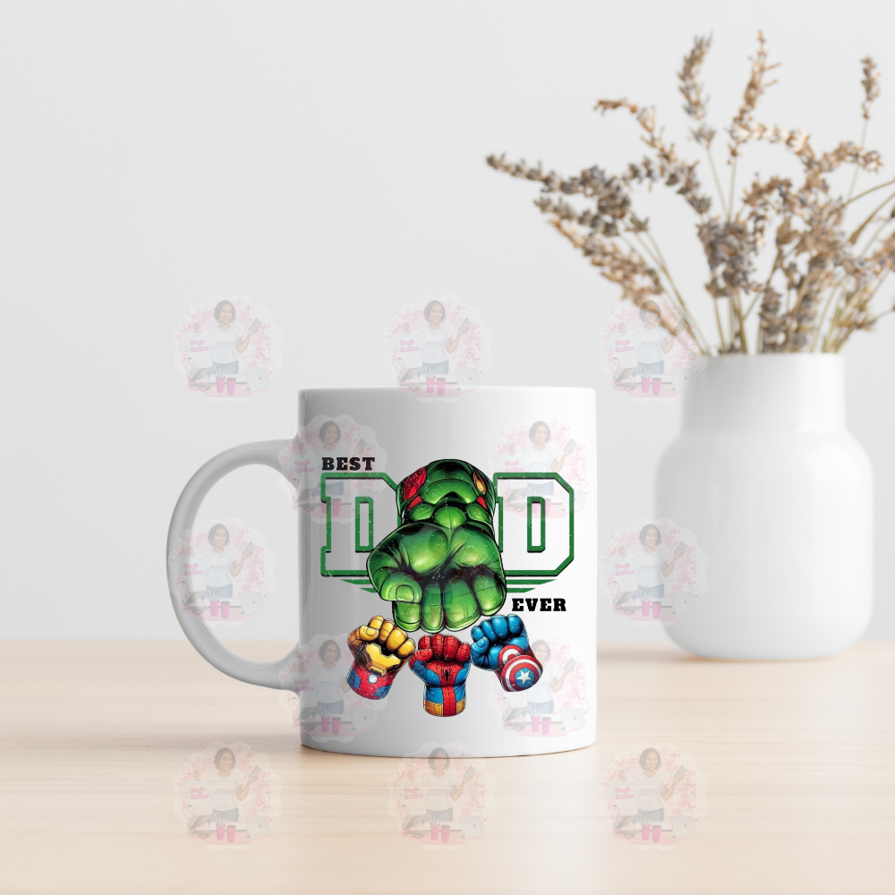 A white ceramic mug with a colorful graphic of a cartoon character and the text 'BEST DAD EVER'.