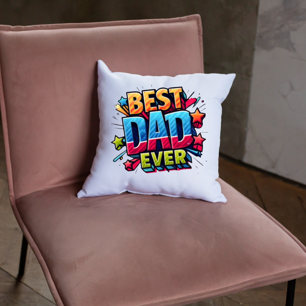 White pillow with 'Best Dad Ever' text on a pink chair